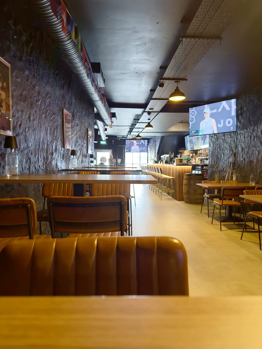 The main bar room with booths and screens