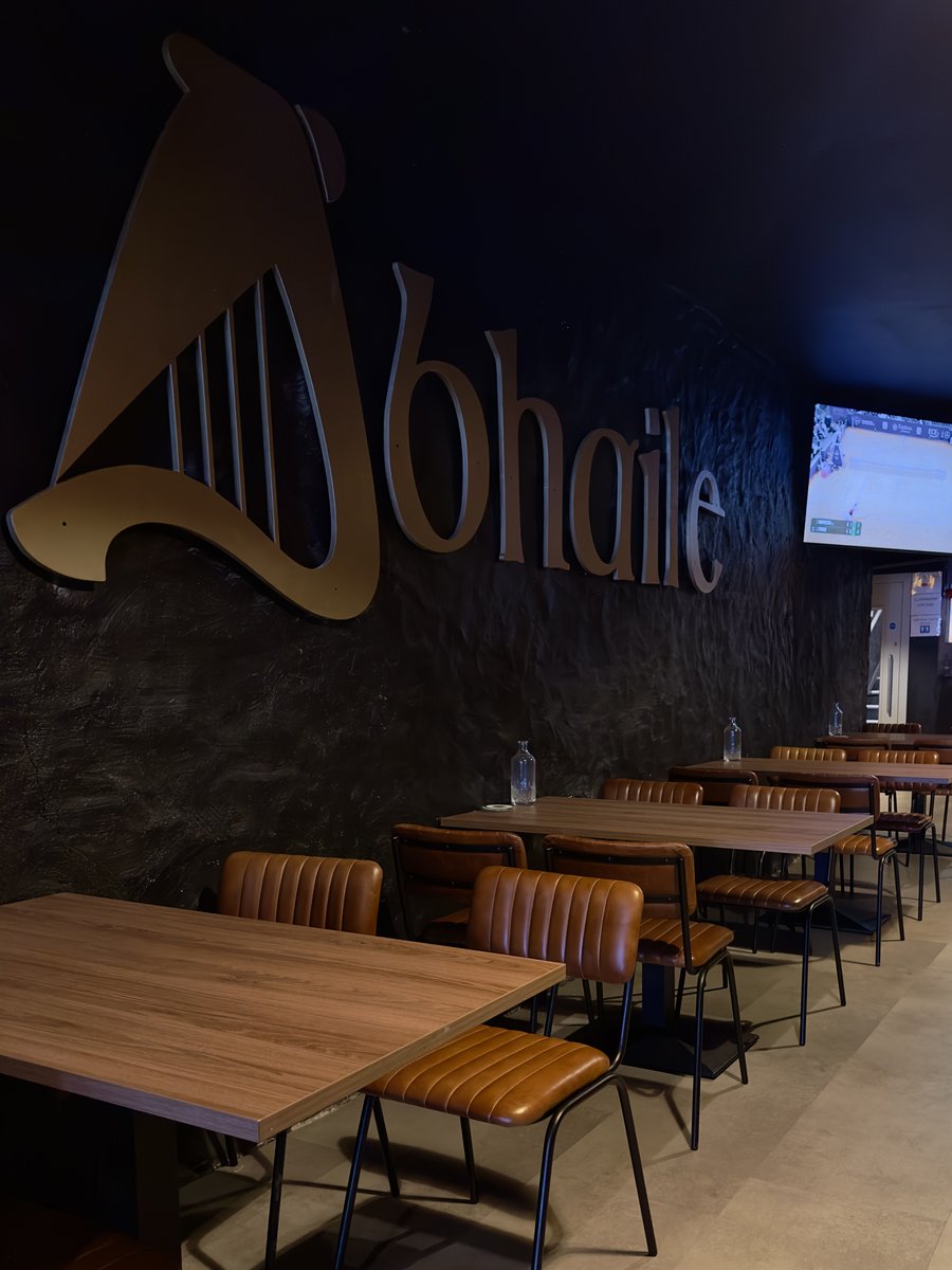 Abhaile harp signage above the tables