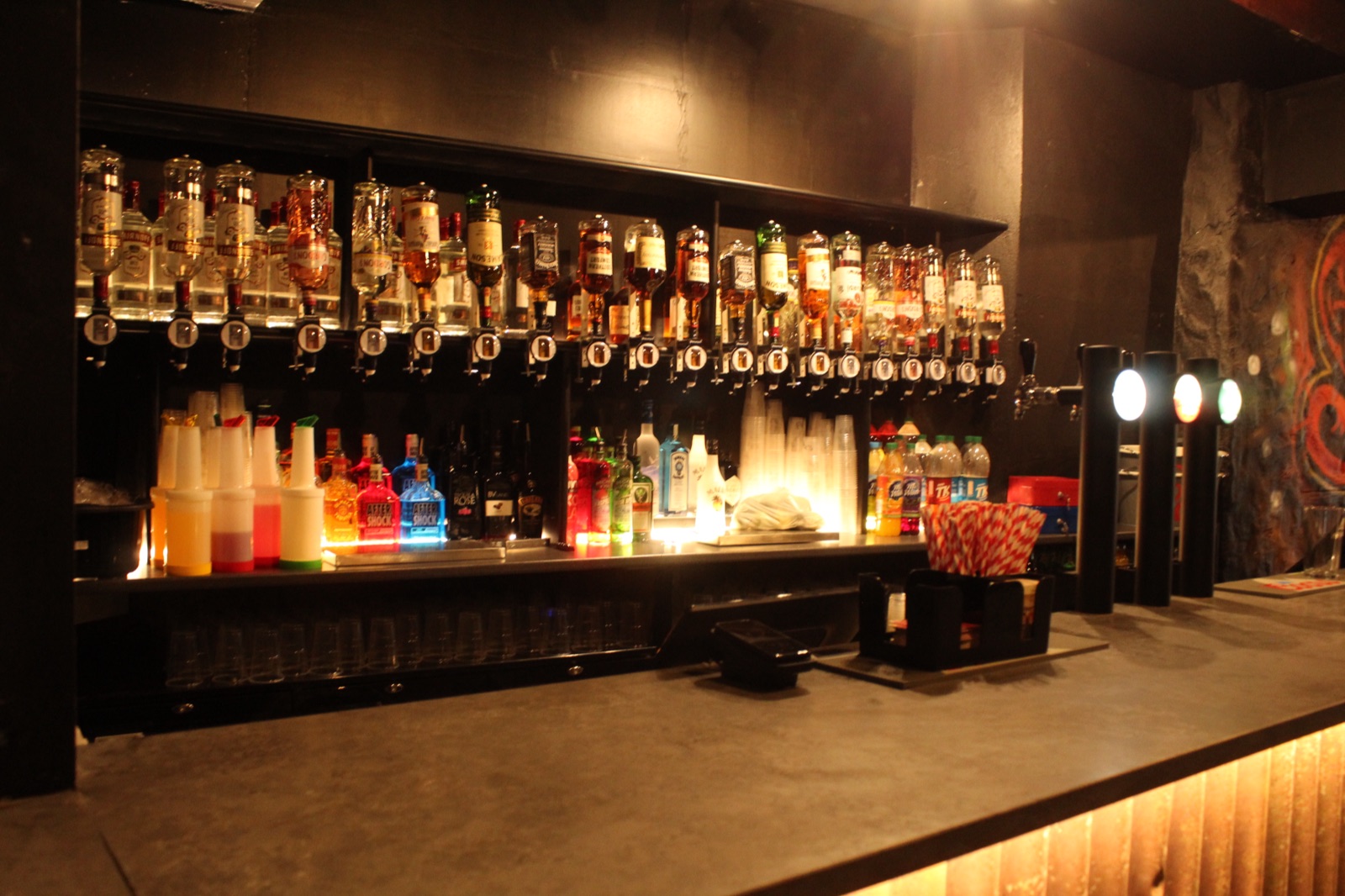The first floor set up for a private party with its own bar and big screens